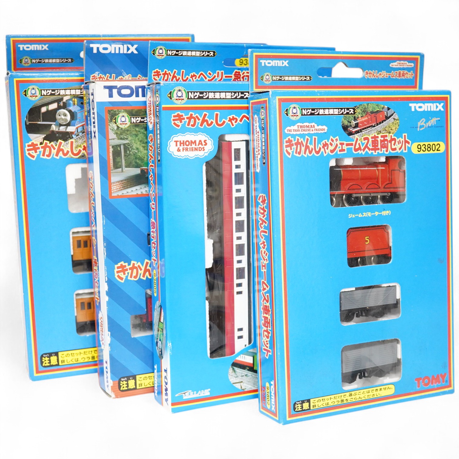 Four boxed Tomix (by Tomy) N gauge railway Thomas the Tank Engine & Friends train packs, comprising of three locomotives and rolling stock (one locomotive missing): James (93802), Henry (93805), Percy (93808) and Thomas